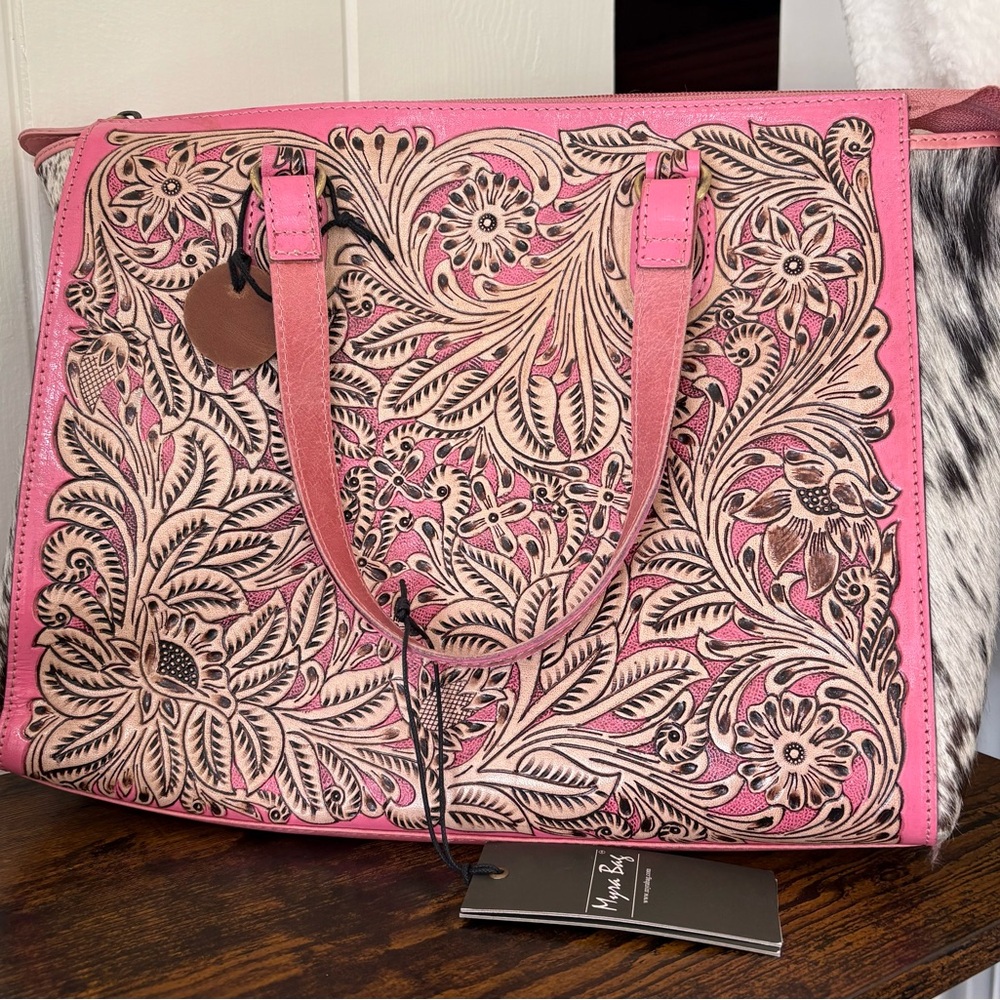 ￼ beautiful leather and hide purse with hand carved lots of detail